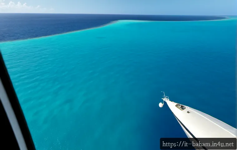 Home 14 바하마와 쿠바의 관계 - Photorealistic aerial view of clear turquoise Caribbean waters between the Bahamas and Cuba, a small...